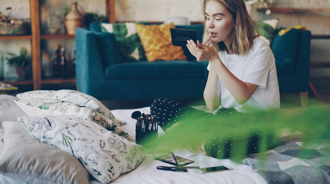 woman packing bags in bedroom